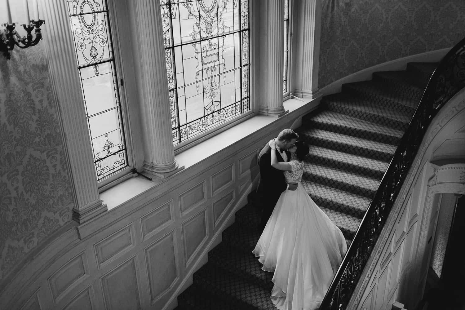 Wedding photos on the staircase at Sleepy Hollow Country Club Wedding
