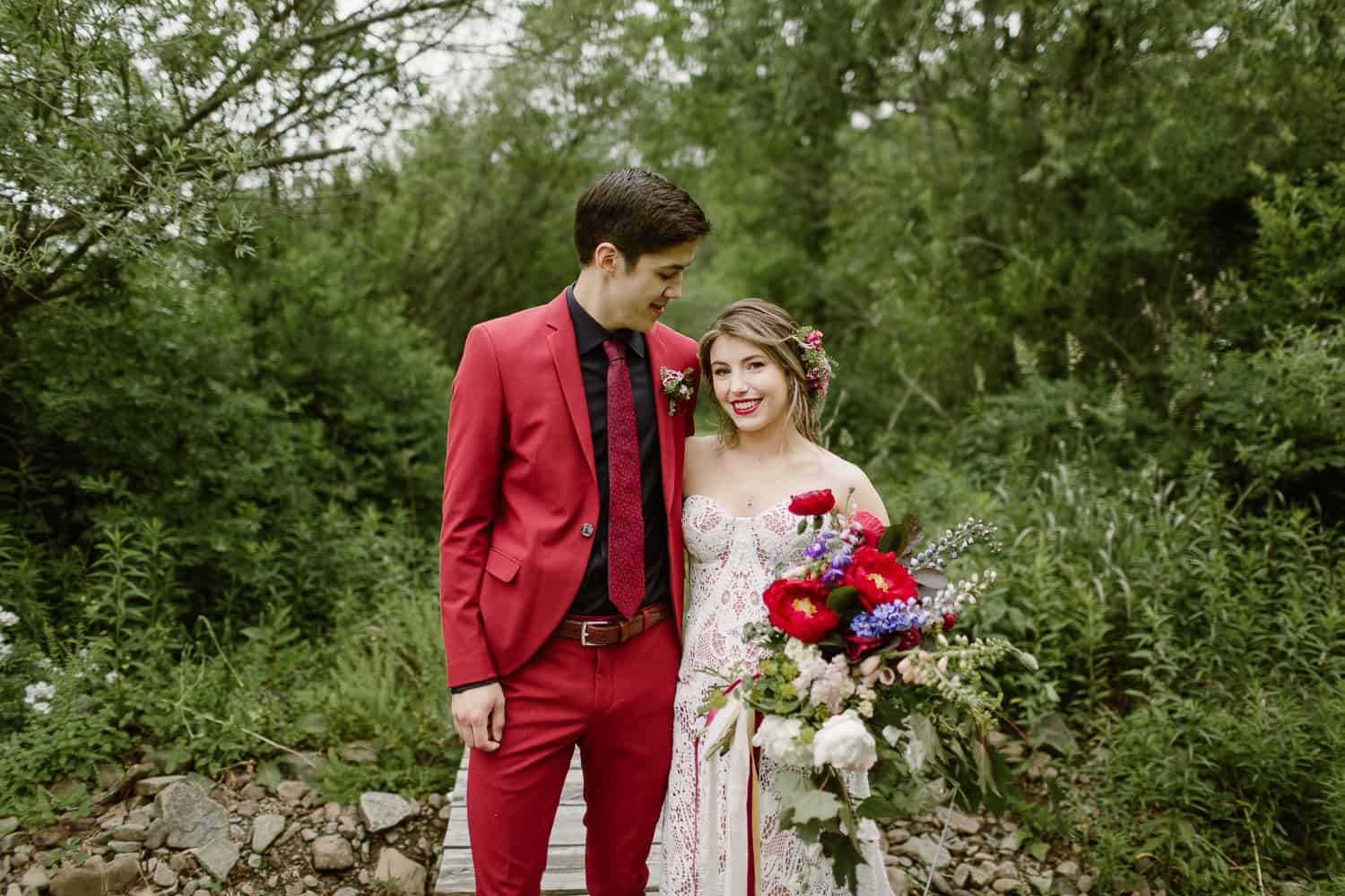 Catskills Wedding with Groom wearing red suit 
