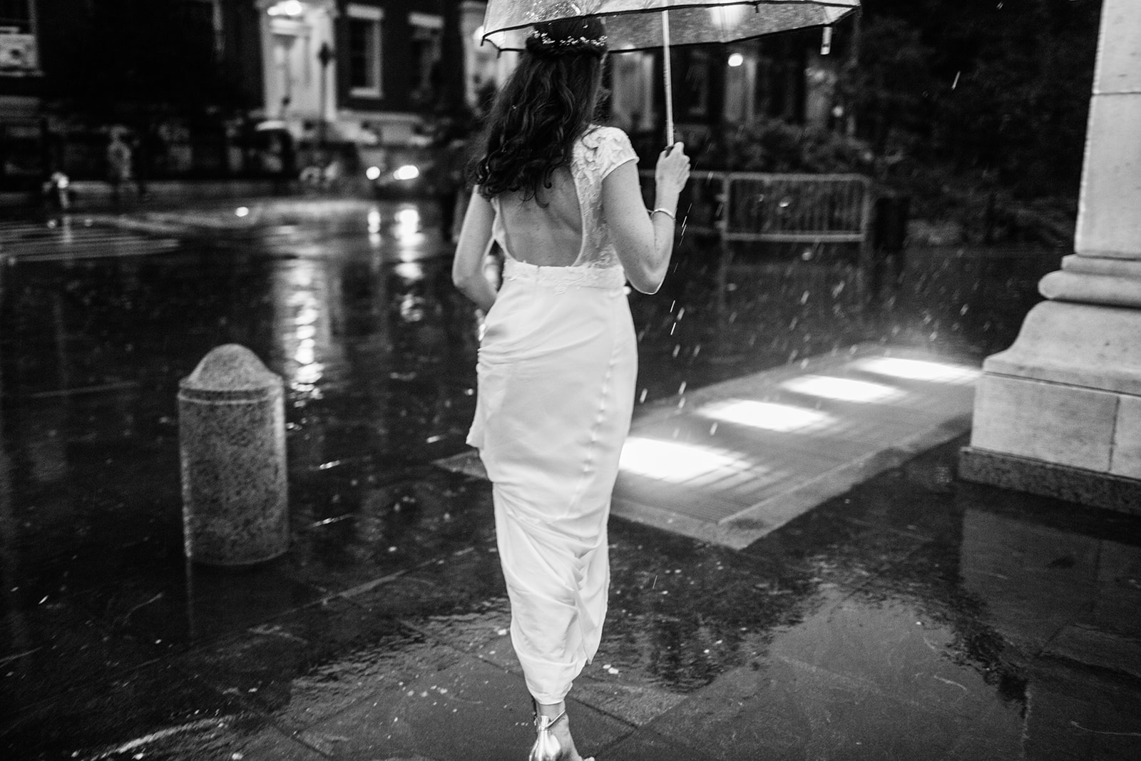 Bride running in a rain 
